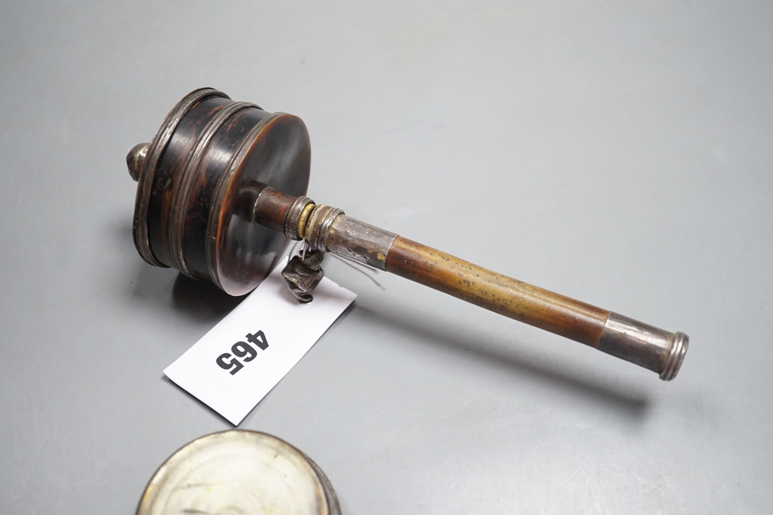 A 19th century Tibetan white metal mounted copper prayer wheel with interior script and a Persian painted mother-of-pearl pill box